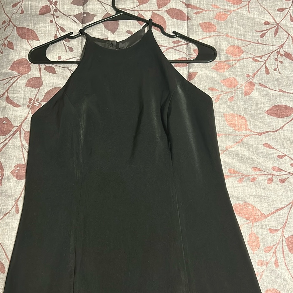 Black dress w/ close neck line & backless.